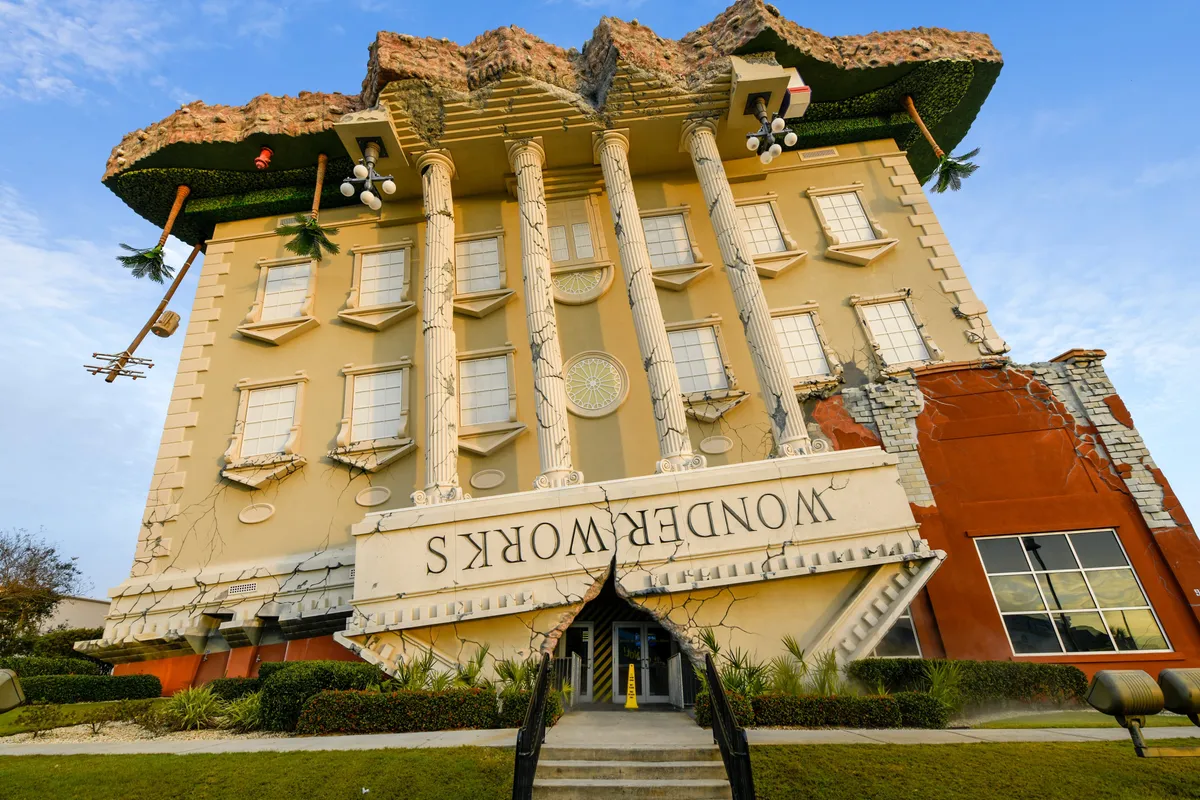 This image presents the unique, upside-down architecture of WonderWorks, with classical columns and a whimsical, distressed facade. The building’s creative and unexpected design sets a playful tone, inviting families and groups to explore interactive, indoor exhibits—ideal for rainy days or when guests seek an alternative to outdoor fun.